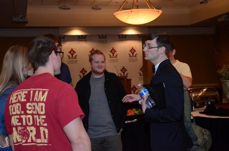 Greg Thornbury, president of The King's College in New York, talks with a group of students during a reception in his and his wife Kimberly's honor in the Carl Grant Events Center. - Photo by Anne Richoux