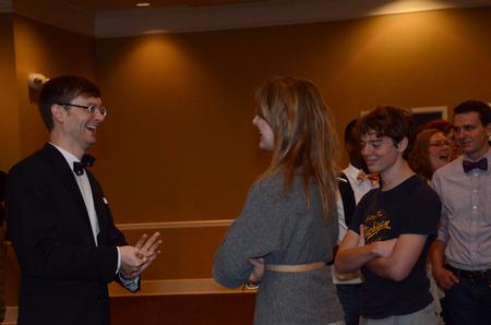 Greg Thornbury, president of The King's College in New York, laughs with Kathleen Hartsfield, senior public relations major, during a reception in honor of the Thornburys in the Carl Grant Events Center. - Photo by Anne Richoux