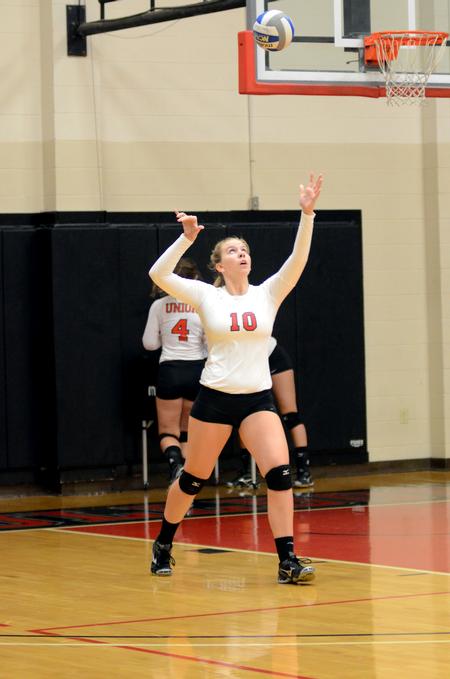 Lady Bulldog McKenna Carter practices serving the ball prior to the volleyball team's game against Harding University (Ark.) at the Fred Delay Gymnasium. - Photo by Anne Richoux