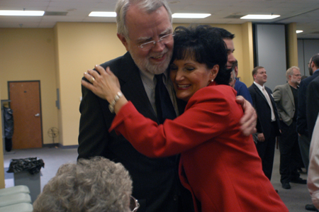 Dr. Joe Blass hugs alum Teresa Clark Wood at a retirement reception in his honor. - Photo by Kristen Nicole Sayres