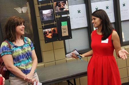 Clare Williams, sophomore journalism major, explains Life Groups to a mother of a perspective student during a preview day. - Photo by Matt McDaniel