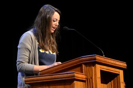 Holly Harris, senior teaching english as a second language major, reads from Philippians in chapel in honor of Leighton Williams. - Photo by Amanda Rohde
