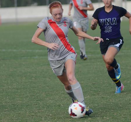Kayleigh Patterson, freshman, passes the ball forward in the game against the University of North Alabama lady Lions. - Photo by Matt McDaniel
