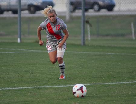 Eliza Clark, junior athletic training major, chases down a ball in the game against the University of North Alabama lady Lions. - Photo by Matt McDaniel