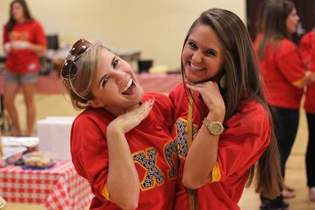 Maggie Robertson, sophomore nursing major, and Hollie Shea Garland, senior sports medicine major, pose at the Chi Omega barbecue for the Make a Wish Foundation. - Photo by Matt McDaniel