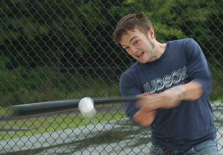 Sophomore Daniel Hall swings at a wiffle ball during a challenge at Pringles Park during the Watters Amazing Race.
 - Photo by Kristen Hiller