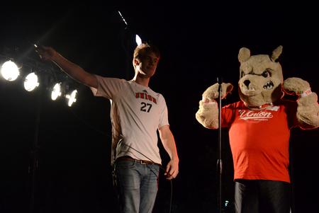 Joe Dresser and Buster the Bulldog get the crowd pumped up during Union Night on the Great Lawn.  - Photo by Anne Richoux