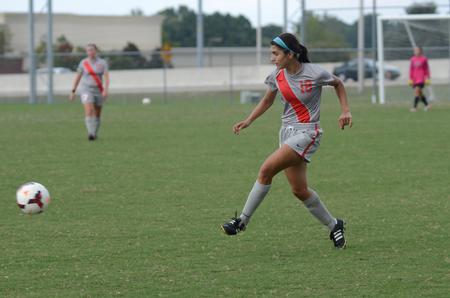 Lady Bulldog Danya Horchi kicks the ball to a teammate during a JV soccer game against Asbury University. - Photo by Anne Richoux