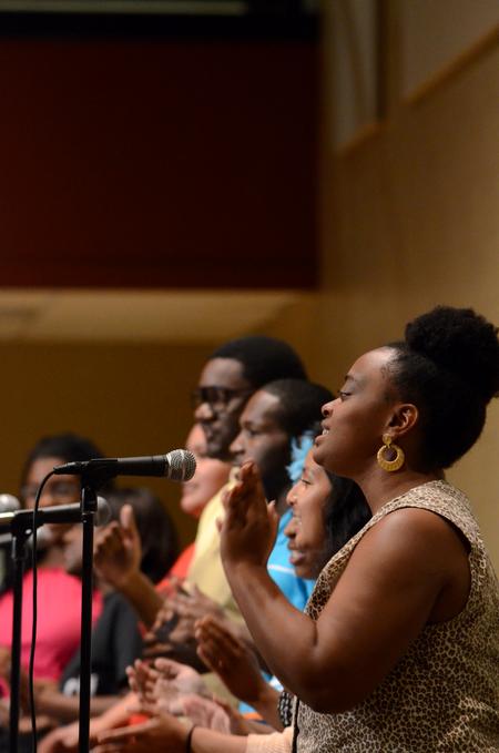 Lizita Bowen, sophomore psychology major, performs with the MOSAIC gospel ensemble at the MOSAIC Unity Showcase.  - Photo by Anne Richoux