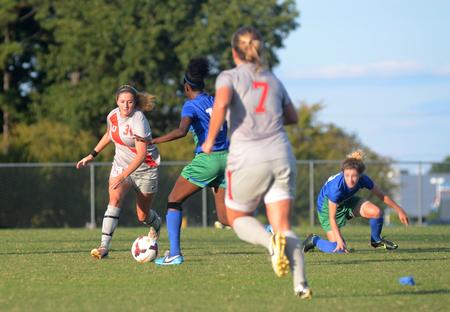 Lady Bulldog Rachael Boswell, senior athletic training major, skillfully steers the ball around University of West Florida players during a game. - Photo by Amanda Rohde