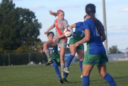Lady Bulldog Kayleigh Patterson, freshman broadcast journalism major, fights for possession of the ball against the University of West Florida. - Photo by Amanda Rohde