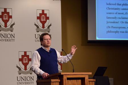 Gene Fant, executive vice president for academic administration and professor of English, speaks to students, faculty, staff, and guests at the Aslan's Apologist Town & Gown lecture series. - Photo by Anne Richoux