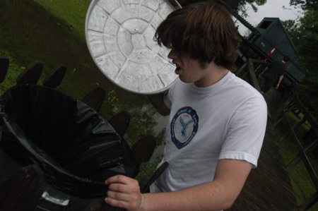 Freshman Daniel (Duckie) Drinkard searches for gift
certificates hidden along the route during the Watters Amazing Race.
 - Photo by Jonathan Blair