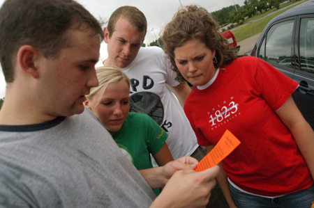Brett Jenkins, Ashley Cherry, Wayne Campbell, and Lauren Oldham read the next route clue during the Watters Amazing Race. - Photo by Jonathan Blair