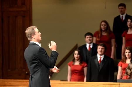 Christopher Mathews, associate professor of music and department chair, directs the Union University Singers at the Fall Choral Concert. - Photo by Amanda Rohde
