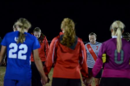 Lady Bulldog Dionna Linn prays with her teammates and opposing team University of Alabama-Huntsville at the end of their game at the Smith Memorial Soccer Complex.  - Photo by Anne Richoux