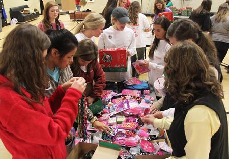 Students participate in Campus and Community: A Day of Remembrance and Service by putting together shoeboxes for Operation Christmas Child in the Bowld Student Commons. - Photo by Matt McDaniel