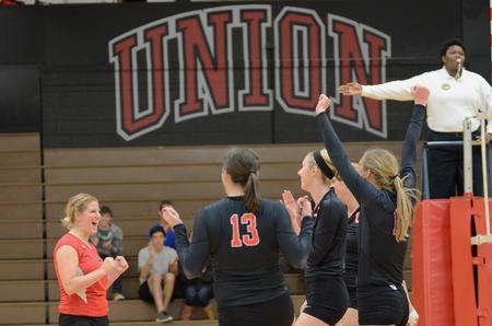 Lady Bulldog Elise Seufert cheers with her teammates after scoring a point during a volleyball game against University of West Florida at the Fred DeLay Gymnasium.  - Photo by Anne Richoux