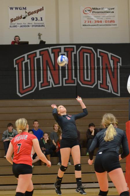 Lady Bulldog Kristin Cook sets the ball during a game against University of West Florida at the Fred DeLay Gymnasium.  - Photo by Anne Richoux