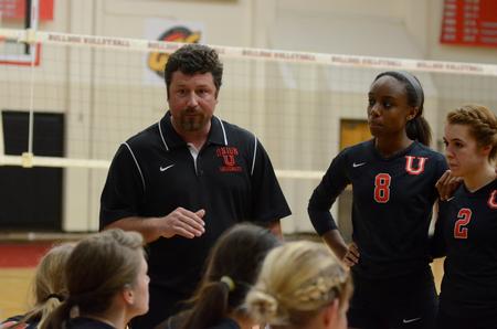 Head coach Tripp Swisher talks with the Lady Bulldogs during a time out in a home game against University of West Florida. - Photo by Anne Richoux