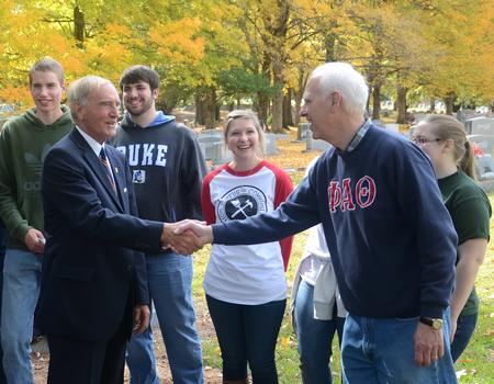 Jackson Mayor Jerry Gist visits with Stephen Carls, university professor of history and department chair, at the historic Hollywood Cemetery during Campus and Community: A Day of Remembrance and Service. Phi Alpha Theta, the history honor society, worked all morning to clean up the cemetery.  - Photo by Jacob Moore