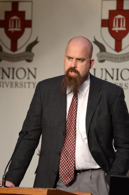 Micah Watson, director for the Center for Politics and Religion, speaks on "Watchful Dragons and the Baptized Imagination" at the Aslan's Apologist Town and Gown lecture series. - Photo by Jacob Moore