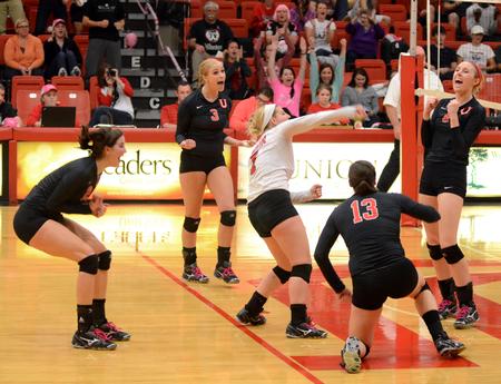 The Lady Bulldogs celebrate after scoring a point against Trevecca Nazarene University at the Fred DeLay Gymnasium. Union won  3-2.  - Photo by Anne Richoux