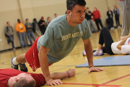 Kemal Gogic, senior business administration major, pushes himself in the push up section of the annual Union's Most Fit competition. - Photo by Matt McDaniel
