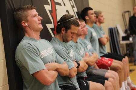 The male competitors participate in the wall sit portion of the annual Union's Most Fit competition. - Photo by Matt McDaniel