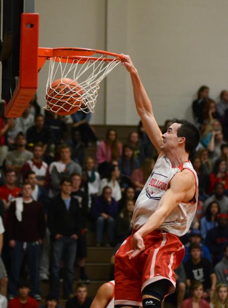Miguel Martinez, sophomore business administration major, dunks in a scrimmage game during Bulldog Madness in the Fred DeLay gymnasium. - Photo by Jacob Moore