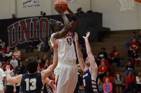 Bulldog Paul Valdor goes up for a shot during a game against Champion Baptist College in the Fred DeLay Gymnasium, which the Bulldogs won 96-54.  - Photo by Anne Richoux