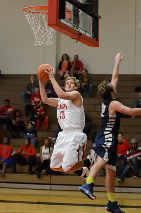 Bulldog Caleb Pittman goes up for a shot during the basketball team's 96-54 win over Champion Baptist College in the Fred DeLay Gymnasium.  - Photo by Anne Richoux