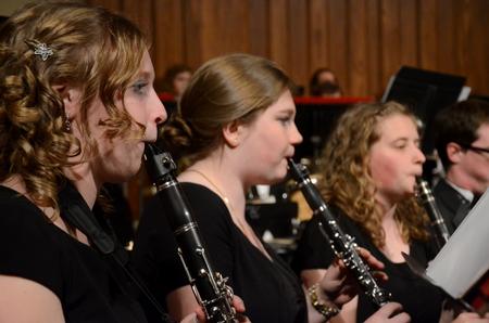 The symphonic band warms up before their concert at First Baptist Church.  - Photo by Anne Richoux