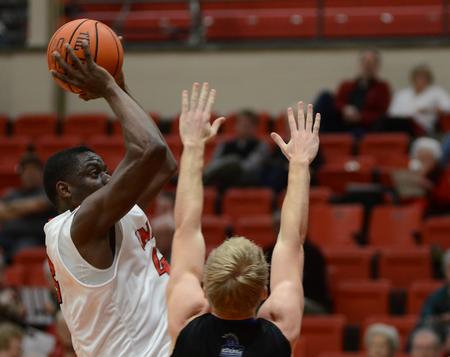 Paul Valdor, senior business administration major, goes up for a shot during the game against the Central Baptist College Mustangs at the Fred DeLay Gymnasium. - Photo by Matt McDaniel