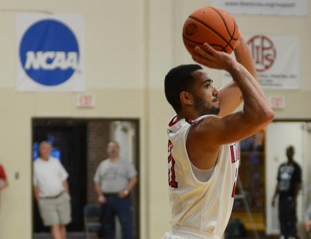 Pedro Faller, junior business administration major, shoots a 3-pointer  during the game against the Central Baptist College Mustangs. - Photo by Matt McDaniel