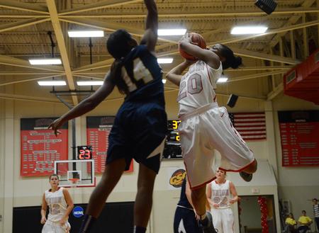 Tymeria Franklin, freshman, takes a difficult shot over the defender during the home opener against the Reinhardt University Lady Eagles. - Photo by Matt McDaniel