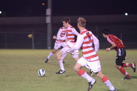 Clayton Martin kicks the ball down the field during a game against Tennessee Temple University as a part of the quarterfinals of the NCCAA  MidEast Region Tournament. Union won 6-1.  - Photo by Anne Richoux