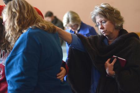 Students and faculty join together to pray in groups during chapel.  - Photo by Amanda Rohde