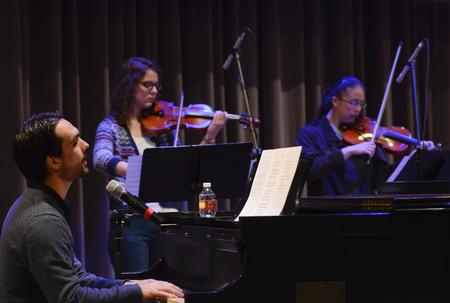 Cody Curtis, assistant resident director for the Male Quads, leads music in chapel. - Photo by Jacob Moore