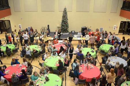Members of the Chi Omega, Kappa Delta, and Zeta Tau Alpha sororities enjoy dinner together at A Panhellenic Christmas in the Bowld Student Commons.  - Photo by Anne Richoux