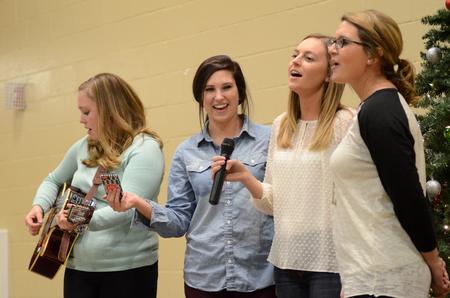 Sorority members lead a Christmas carol at the end of A Panhellenic Christmas in the Bowld Student Commons.  - Photo by Anne Richoux