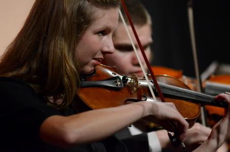 Anna Frederick, senior elementary education major, plays with the University Symphony as a part of their performance in "A Union Christmas." - Photo by Anne Richoux