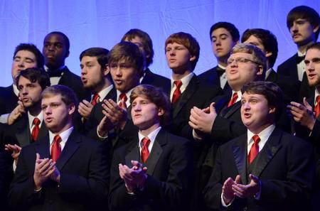 Members of University Singers and the Men's Choir sing during the annual "A Union Christmas" in the G.M. Savage Memorial Chapel.  - Photo by Anne Richoux