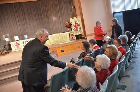 David S. Dockery, president of the university, greets friends before the a chapel service in his honor. - Photo by Morris Abernathy