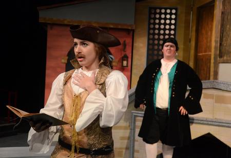Sarah Halbrook, senior English major, performs as Beatrice Rasponi as Pantalone, played by Barry DeCoursey, sophomore music major, looks on. - Photo by Jacob Moore