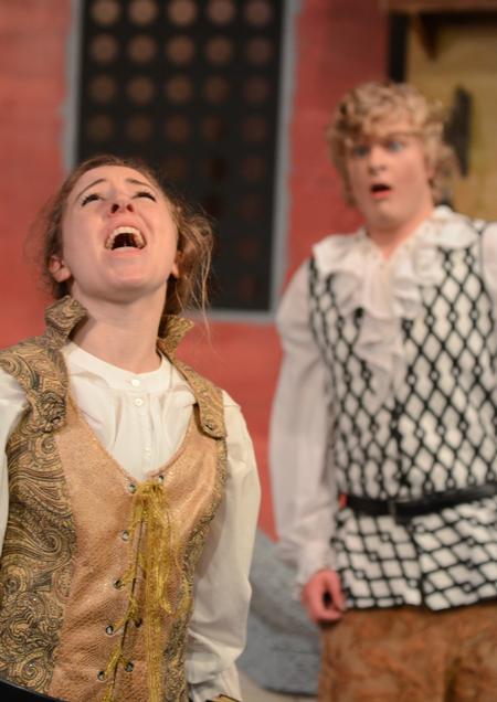 Sarah Halbrook, senior English major, performs a scene with Daniel Poore, junior theatre major, in the Union University Players "The Servant of Two Masters" in the W.D. Powell Theatre. - Photo by Jacob Moore