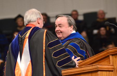 David Dockery, president of the university, introduces J. Michael Duduit, dean of the College of Christian Studies, Anderson University, who gives the commencement address at Fall Commencement Services. - Photo by Amanda Rohde