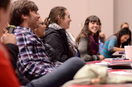 Students laugh during the first Student Senate of the semester in Harvey Auditorium. - Photo by Anne Richoux