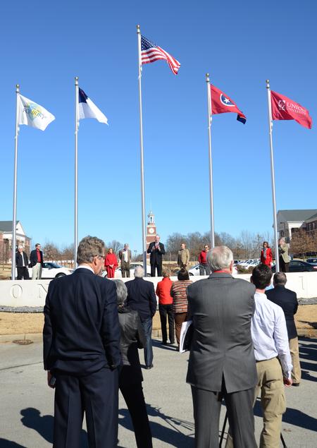 David S. Dockery, president of the university, thanks the Class of 1963 for donating the new flags and poles at the entrance to campus. - Photo by Amanda Rohde