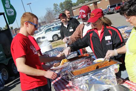 Michael Adkisson, junior business administration major, gets some chips at the Union Strong event during homecoming weekend. The event was a time for the Union community to come together and enjoy fellowship. - Photo by Matt McDaniel